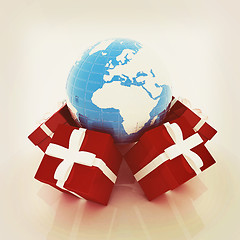 Image showing Traditional Christmas gifts and earth. Global holiday concept . 