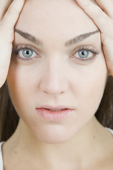 Image showing stylish young woman posing in clear background