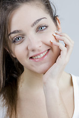 Image showing stylish young woman posing in clear background