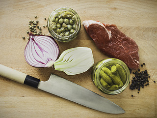 Image showing mixing steak tartare ingredients in a bowl