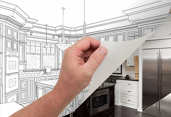 Image showing Hand Turning Page of Custom Kitchen Drawing to Photograph