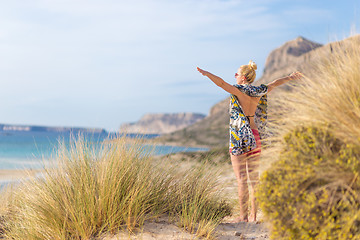 Image showing Free Happy Woman Enjoying Sun on Vacations.