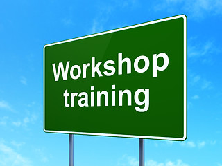 Image showing Learning concept: Workshop Training on road sign background