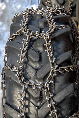 Image showing Spike chain on tractor wheel