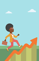 Image showing Business woman running along the growth graph.