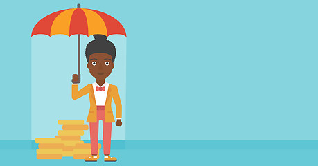 Image showing Business woman with umbrella protecting money.