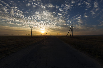 Image showing power poles in the field