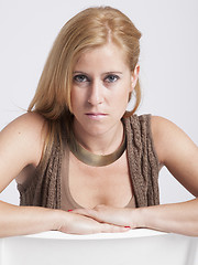 Image showing stylish young woman posing in clear background