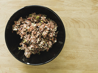 Image showing mixing steak tartare ingredients in a bowl