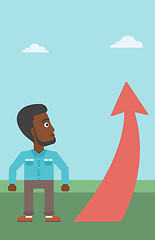 Image showing Businessman looking at arrow going up.