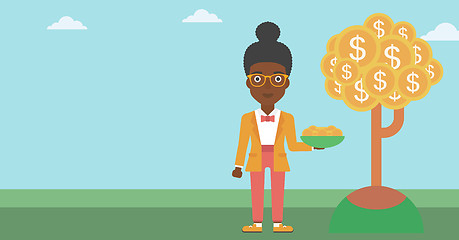 Image showing Business woman catching dollar coins.