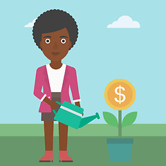 Image showing Business woman watering money flower.