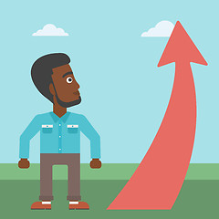 Image showing Businessman looking at arrow going up.