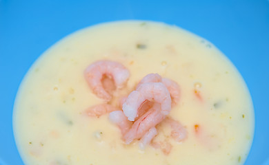 Image showing Fish soup with shrimps in the blue bowl