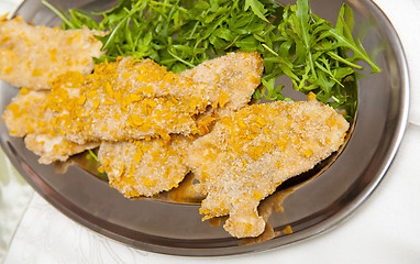 Image showing Meat with corn breadcrumbs on the silver plate