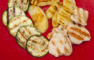 Image showing Grilled dinner on the red plate