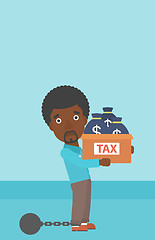 Image showing Chained businessman with bags full of taxes.