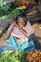 Image showing Tribal villagers bargain for vegetables. Sonakhali, West Bengal, India