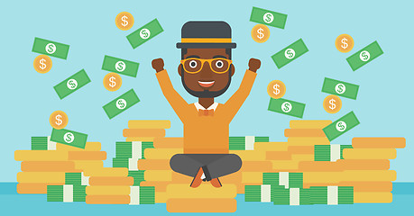 Image showing Happy businessman sitting on coins.