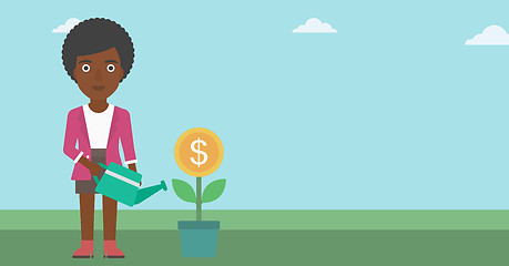 Image showing Business woman watering money flower.