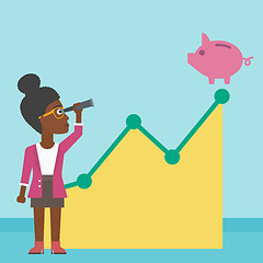 Image showing Business woman looking at piggy bank.