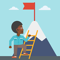 Image showing Businessman climbing on mountain.