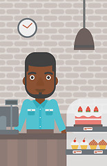 Image showing Worker standing behind the counter at the bakery.