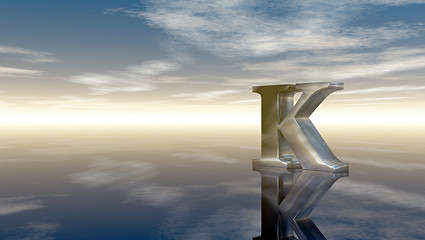 Image showing metal uppercase letter k under cloudy sky - 3d rendering