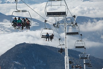 Image showing Skiers on lift