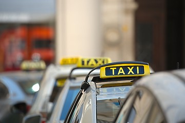 Image showing Taxis on a street