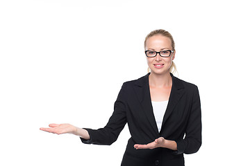 Image showing Business woman showing hand sign to side.