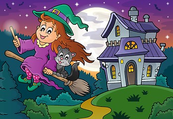 Image showing Cute witch on broom near haunted house