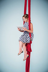 Image showing Graceful gymnast sitting with laptop