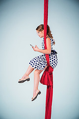 Image showing Graceful gymnast sitting with laptop