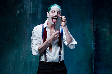 Image showing Bloody Halloween theme: crazy joker face