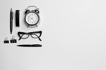 Image showing The clock, pen, and glasses on white background