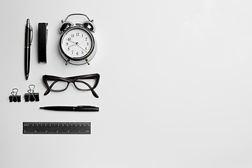 Image showing The clock, pen, and glasses on white background