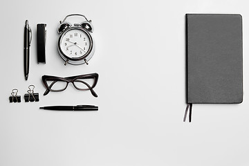 Image showing The clock, pen, and glasses on white background