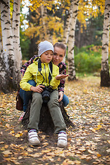 Image showing Woman and her son with camera