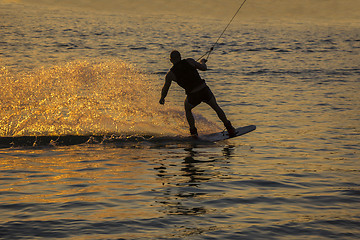 Image showing Silhouette Wakeboarder in action on sunset