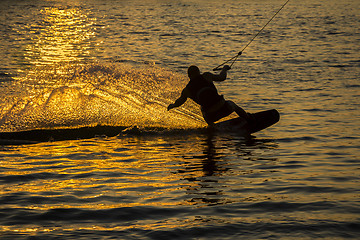 Image showing Silhouette Wakeboarder in action on sunset