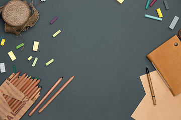 Image showing Office desk table with pencils, supplies