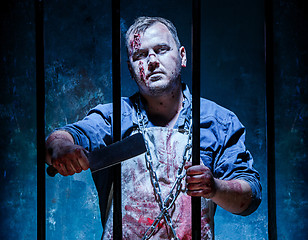 Image showing Bloody Halloween theme: crazy killer as butcher with a knife