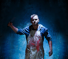 Image showing Bloody Halloween theme: crazy killer as butcher with a knife