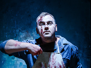 Image showing Bloody Halloween theme: crazy killer as butcher with a knife