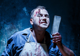 Image showing Bloody Halloween theme: crazy killer as butcher with a knife