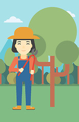 Image showing Female farmer using pruner vector illustration.