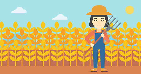 Image showing Female farmer with pitchfork vector illustration.