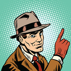 Image showing Male spy points a finger, retro background