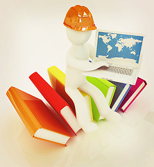Image showing 3d man in hard hat sitting on books and working at his laptop . 